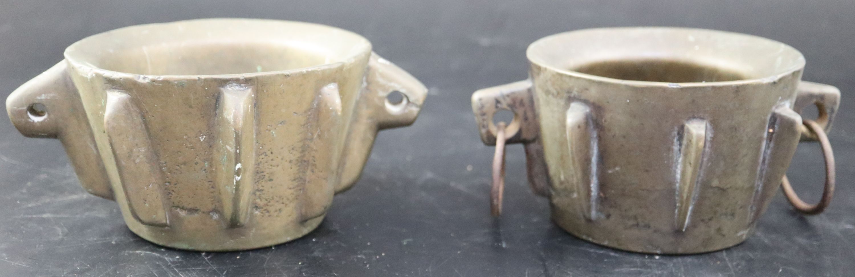 Two Spanish bronze mortars, height 8cm over handles 18cm